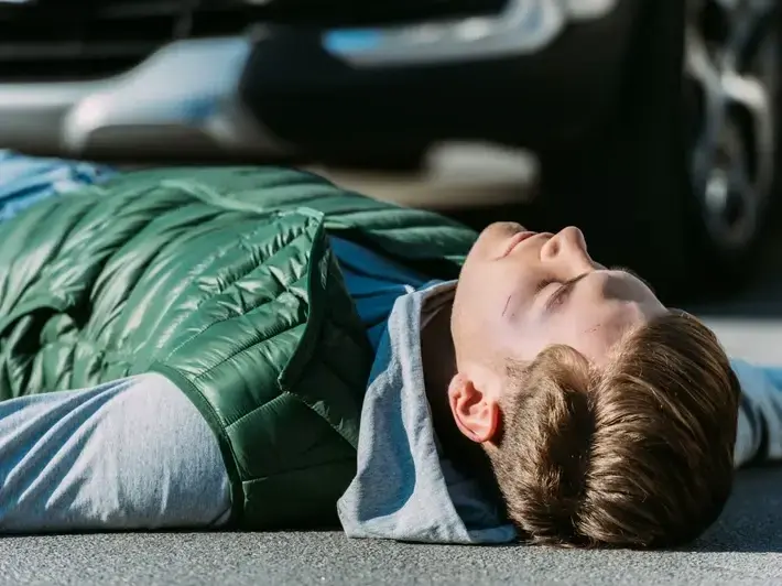 Buckeye DUI victim injury lawyer reviewing crash photos from a wide suburban arterial near Historic Downtown Buckeye